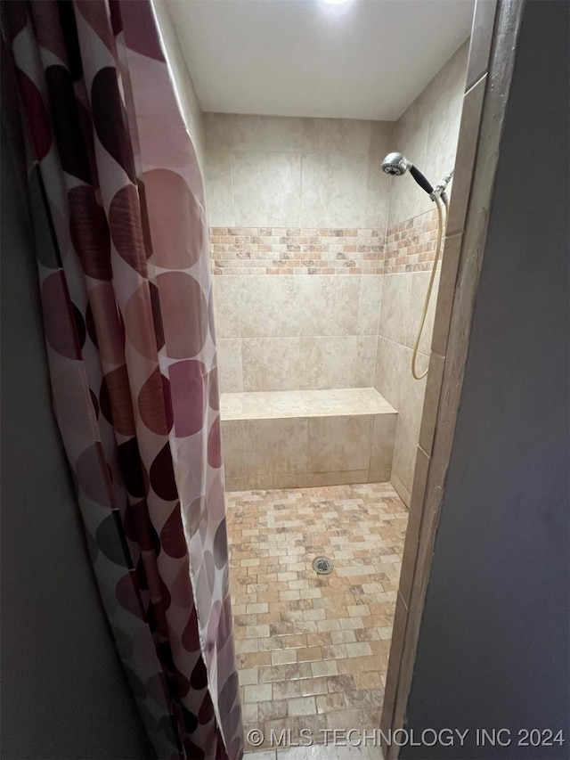 bathroom with a shower with shower curtain