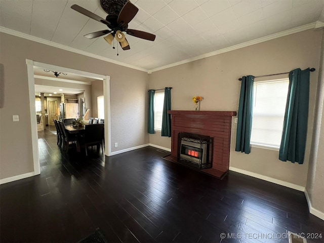 living room featuring dark hardwood / wood-style floors, ceiling fan, ornamental molding, and a wealth of natural light