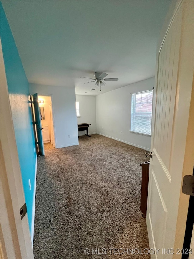 interior space featuring ceiling fan