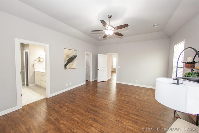 unfurnished living room featuring dark hardwood / wood-style floors and ceiling fan