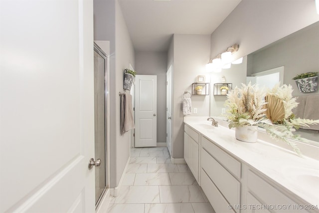 bathroom with vanity and an enclosed shower