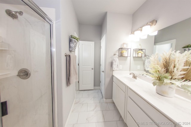 bathroom with vanity and a shower with shower door