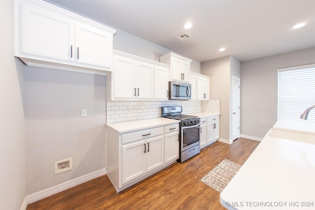 kitchen featuring white cabinets, dark hardwood / wood-style floors, sink, and stainless steel appliances