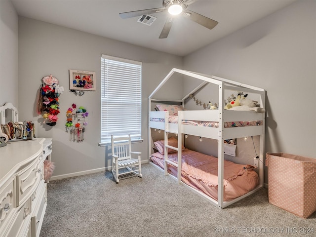 carpeted bedroom featuring multiple windows and ceiling fan