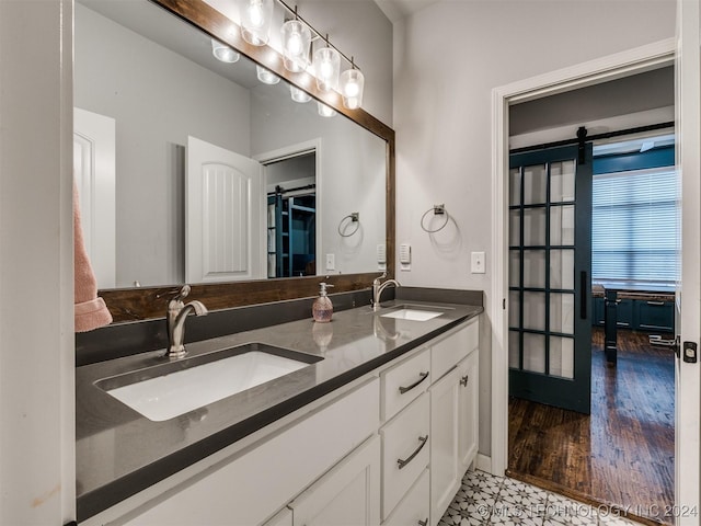 bathroom with vanity and hardwood / wood-style flooring