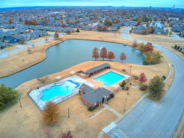 view of swimming pool featuring a water view