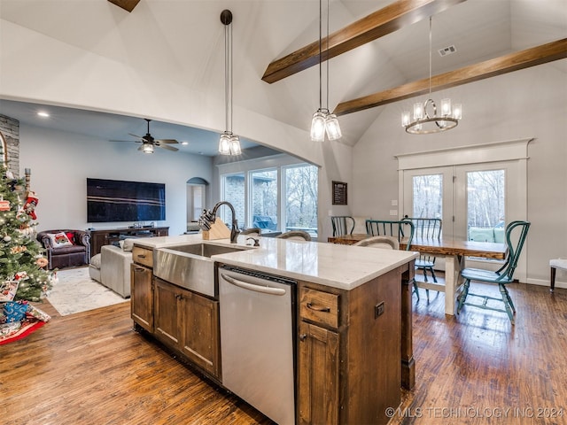 kitchen with beamed ceiling, stainless steel dishwasher, pendant lighting, wood-type flooring, and a center island with sink