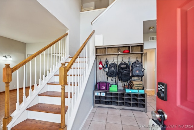 stairway featuring wood-type flooring