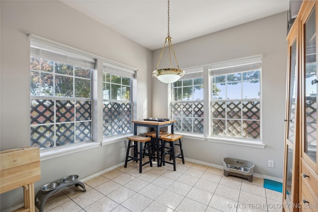 dining area with light tile patterned flooring