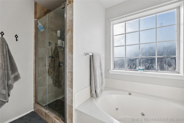 bathroom with shower with separate bathtub