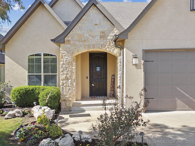 doorway to property featuring a garage