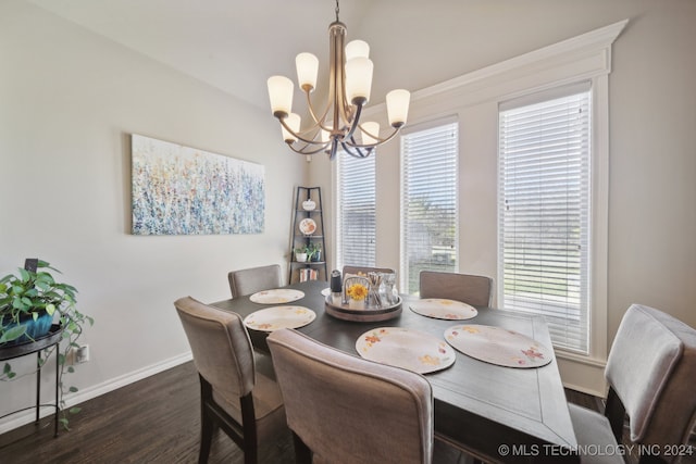 dining room with a notable chandelier and dark hardwood / wood-style floors