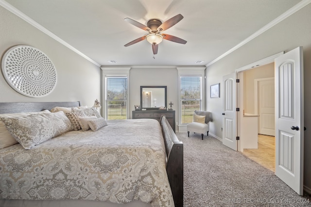 bedroom featuring light carpet, crown molding, and multiple windows