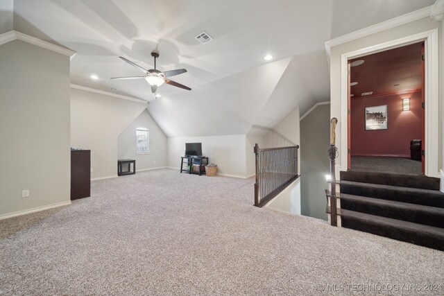 additional living space featuring carpet flooring, ceiling fan, and lofted ceiling