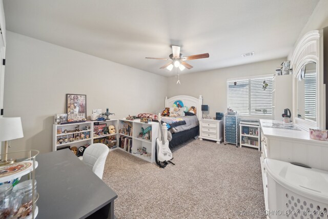 bedroom featuring ceiling fan and carpet floors