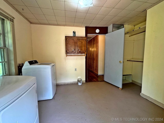 laundry area with independent washer and dryer