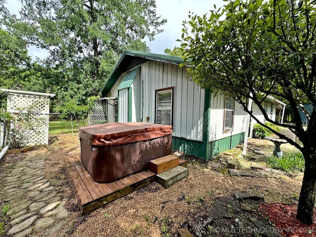 view of outdoor structure featuring a hot tub