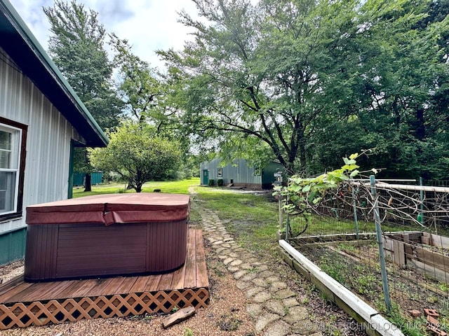 view of yard featuring a hot tub and a deck