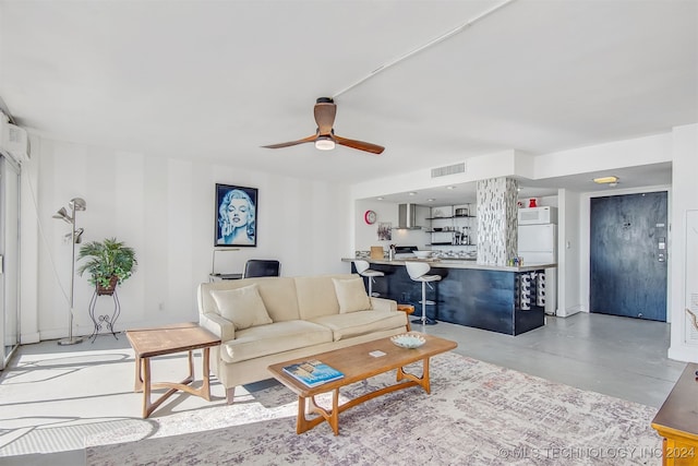 living room with concrete floors and ceiling fan