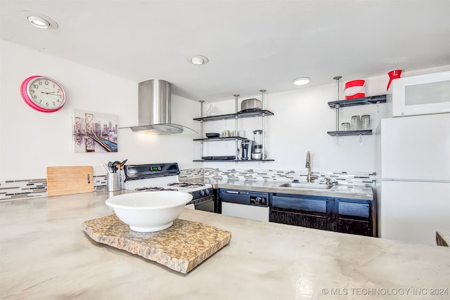 kitchen featuring tasteful backsplash, white appliances, wall chimney range hood, and sink