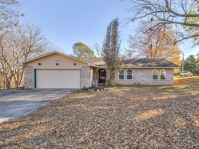 single story home with a garage