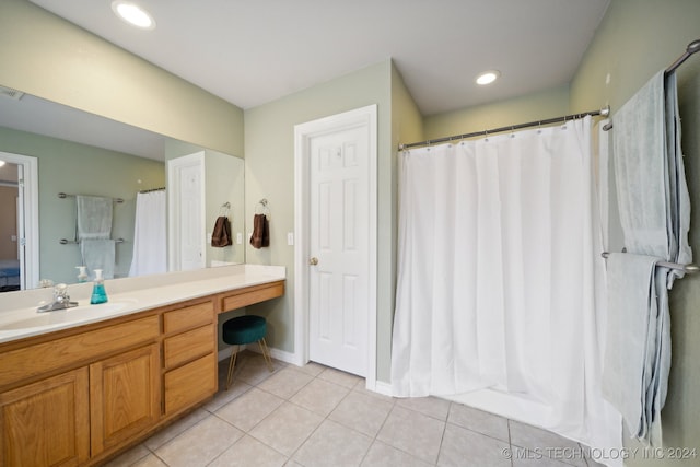 bathroom featuring tile patterned floors and vanity