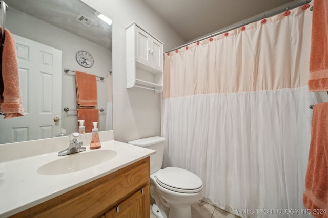 bathroom with tile patterned floors, vanity, and toilet