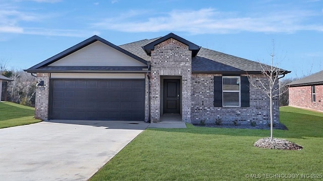 view of front of home with a garage and a front yard