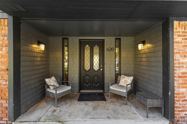 view of exterior entry featuring a porch