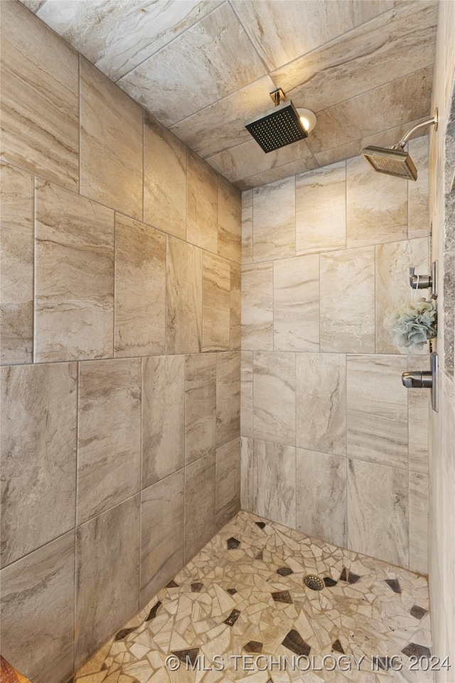 bathroom with a tile shower