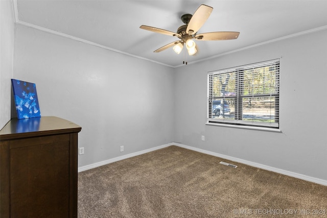 spare room with carpet, ceiling fan, and crown molding