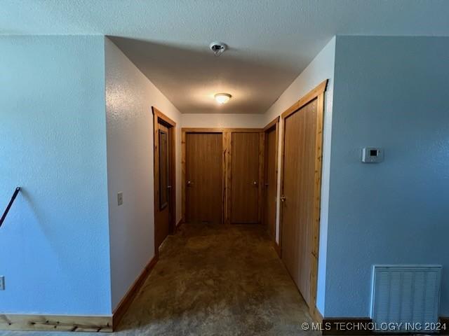 corridor featuring carpet floors