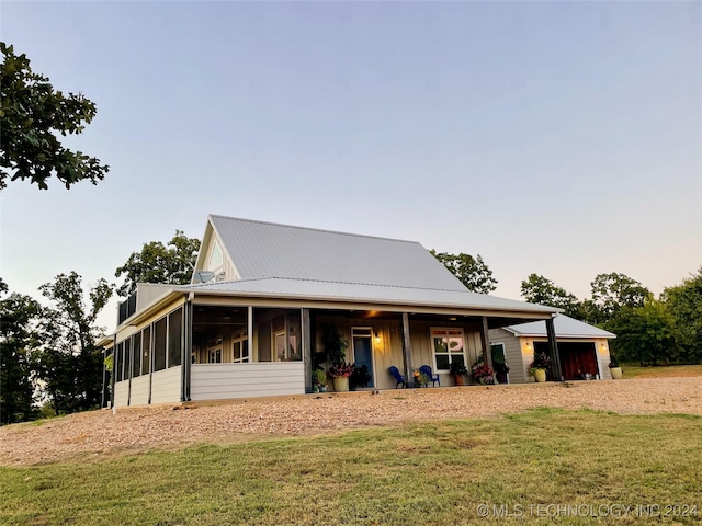 country-style home with a front yard