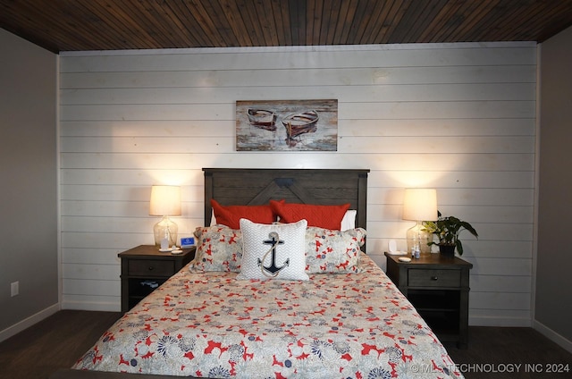 bedroom featuring dark hardwood / wood-style floors, wooden ceiling, and wooden walls