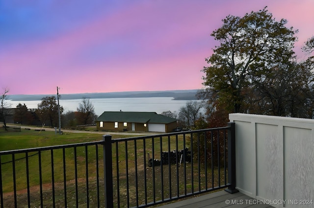 balcony at dusk with a water view