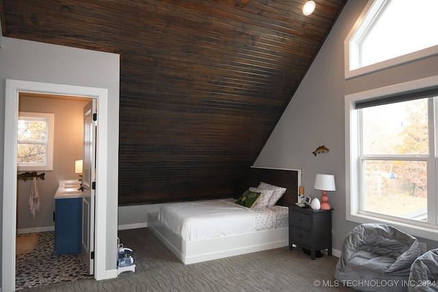 carpeted bedroom featuring lofted ceiling and wood ceiling