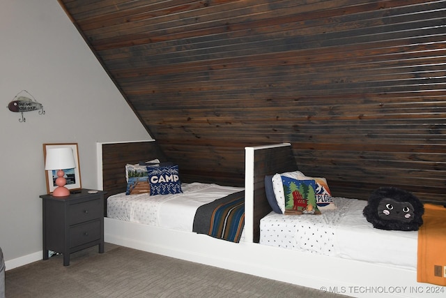 bedroom featuring dark carpet, wood ceiling, and vaulted ceiling