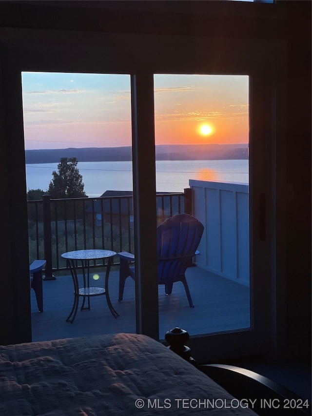 bedroom featuring a water view