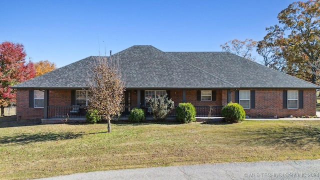 ranch-style house with a front lawn