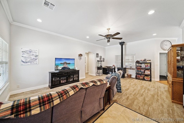 living room with ceiling fan and crown molding