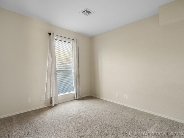 unfurnished room with carpet floors