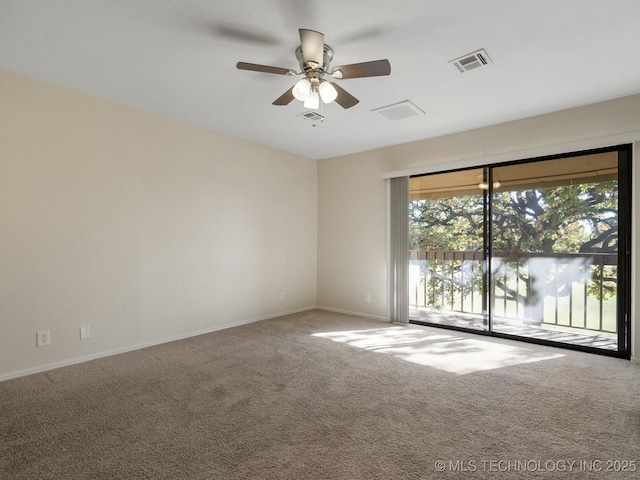 empty room with ceiling fan and carpet