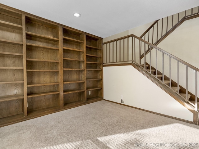 unfurnished living room featuring carpet flooring