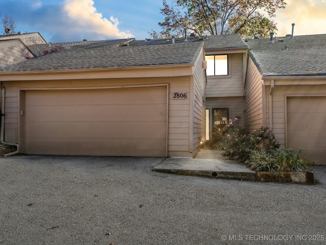 multi unit property featuring roof with shingles