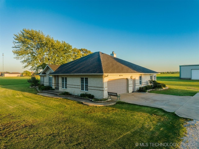 property exterior at dusk featuring a garage and a lawn