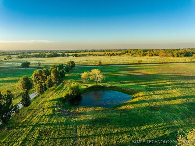 drone / aerial view with a rural view and a water view