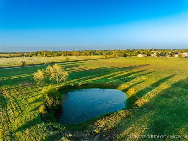 aerial view with a water view and a rural view