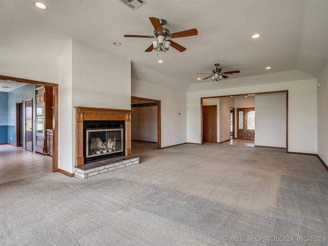 unfurnished living room with carpet, ceiling fan, and vaulted ceiling