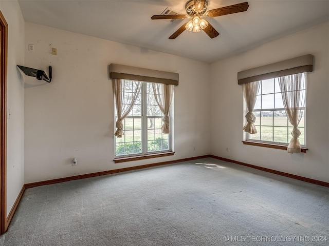 carpeted empty room with ceiling fan