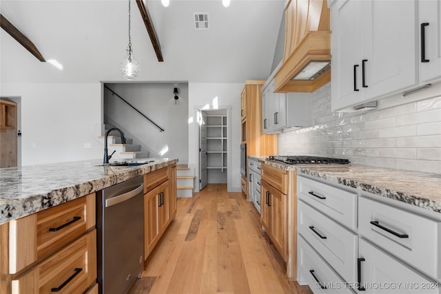 kitchen with sink, decorative light fixtures, light hardwood / wood-style floors, white cabinetry, and stainless steel appliances